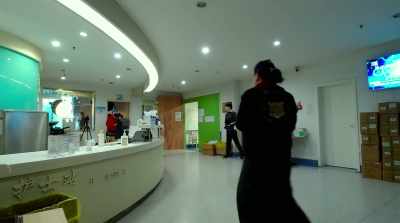In one moment captured by
a camera placed in the lobby, - In the Same Breath