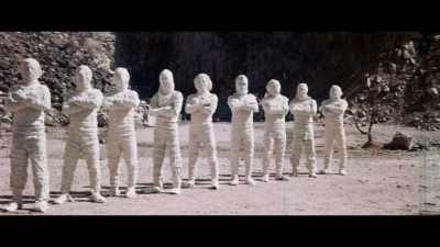 In the background, guys are
disguised as mummies, - Enter the Clones of Bruce