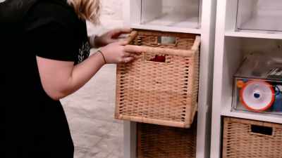 In the cubbies,
we're using large square baskets - Get Organized with The Home Edit