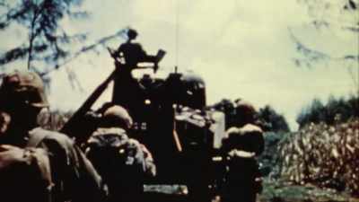 IN THE ISLAND'S
TALL SUGAR CANE FIELDS. - The Pacific War in Color