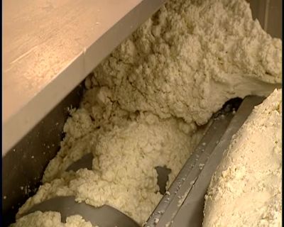 IN THE MOLDER,
THE CHEESE IS CUT UP - How It's Made