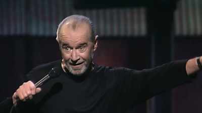(INDISTINCT CHANTING) - George Carlin's American Dream