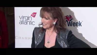 -[indistinct chatter]
-[camera shutters clicking] - Lady Boss: The Jackie Collins Story