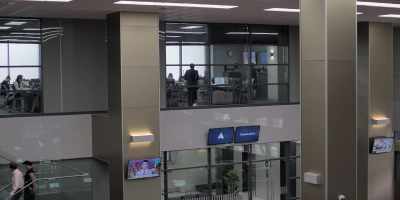 -(INDISTINCT OFFICE CHATTER)
-(TELEPHONES RINGING) - Industry