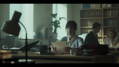 [indistinct office chatter] - The Crown