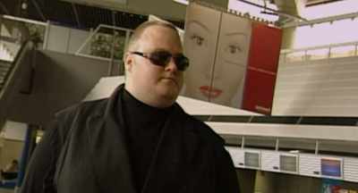 [indistinct voice over PA] - Kim Dotcom: Caught in the Web