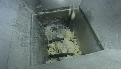 INSIDE THE NEXT HOPPER,
ANOTHER AUGER TURNS. - How It's Made