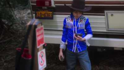 It says "GPS Trackit." - AJ and the Queen