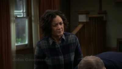 It says,
"Welcome home, Louse." - The Conners