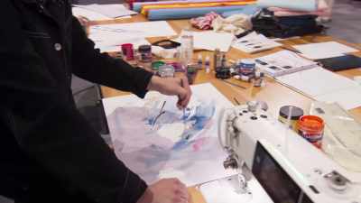 It's a race against the clock to
get it painted and sent to the printers. - Next in Fashion