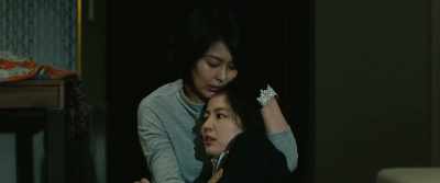 It's a woman named Katagiri Yoko. - Masquerade Hotel