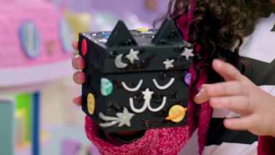 It's covered in sparkly planets and stars. - Gabby's Dollhouse