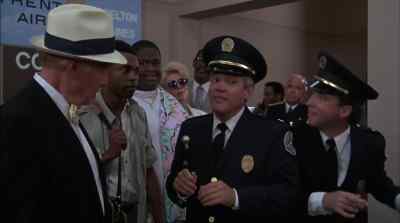 It's probably the buckle, sir.
Here, I get it. - Police Academy 5: Assignment: Miami Beach
