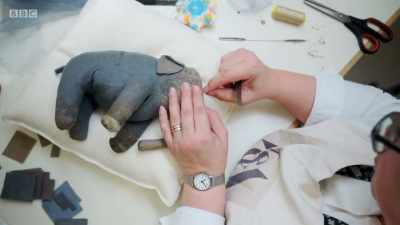 It's really hard, trying to feed
that long piece of felt - Secrets of the Museum