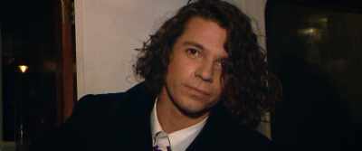 J riding in a boat - Mystify: Michael Hutchence