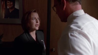 Janet Reno on the wall. - The X-Files