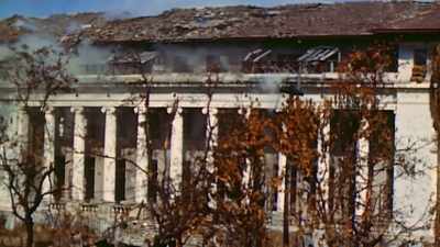 Japanese rifles
crack from the top floor. - The Pacific War in Color