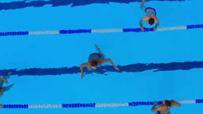 [jaunty music] - Swimming for Gold