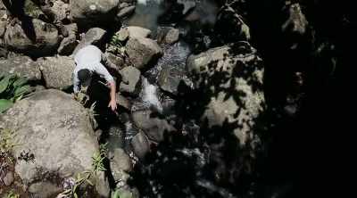 ‐ John and Manny
head up to the waterfall - Lost Gold of World War II