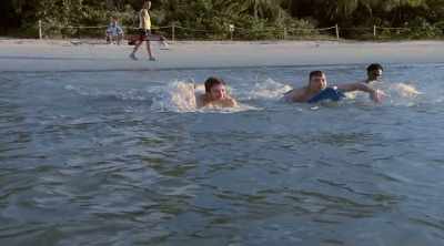 Jordon and his brother head
into the surf to cool off. - Shark Attack Files