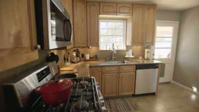 -[Julee] This is
our kitchen space.
-This is, like, tight. - Why the Heck Did I Buy This House?