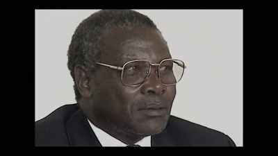 [Kabuga speaks indistinctly
in the background] - World's Most Wanted