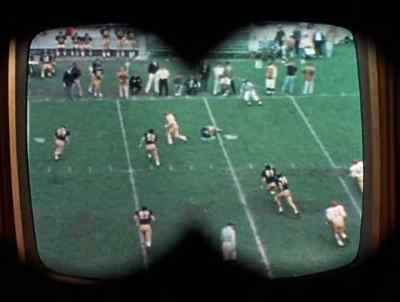 Landis fading back to
pass, Wolinsky's open - Love, American Style