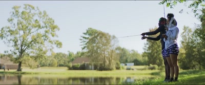 [Leanna] You caught one baby, point
two-pound fish. - Coach Prime