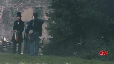 >> LINCOLN IS GIVEN A CAPTURED
CONFEDERATE FLAG, AND HE GIVES - Lincoln: Divided We Stand