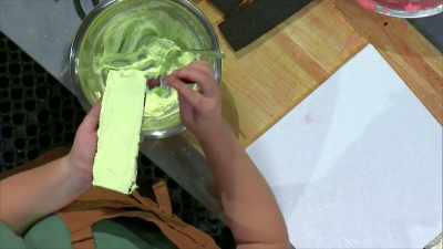 [Lisa] I'm scraping
my melon liqueur royal icing - Halloween Cookie Challenge