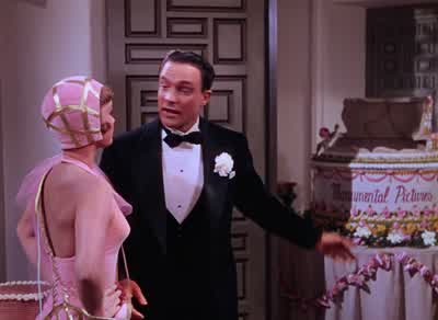 Listen Mr Lockwood Say who is this dame anywaySomeone lofty and far above us allShe couldn't learn anything from the movies She's a stage actress - Singin' in the Rain