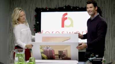Little boy races towards
the biggest gift under the tree - With Love, Christmas