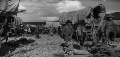 Look how queer his horse is acting - The Big Trail
