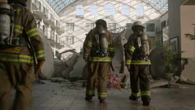 Looking for survivors
in the debris pile, - Fire Country