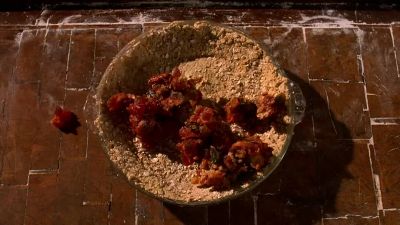 Lumpy oatmeal with fruitcake mashed in - Waitress