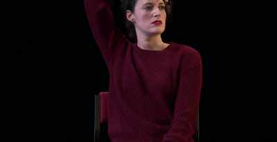 Makes her look pretty badass.
She has a very straight expression. - Great British Theatre