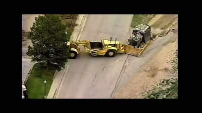 - [man 1] Get him back! Stop him!
- [man 2] I can't, he's got a dozer. - Tread