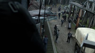Man: Get that last barrel loaded. - The 100