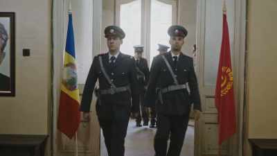 MAN (OVER P.A.): All units,
Detectives Baciu and Anghel - Comrade Detective