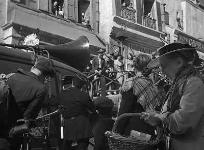[MAN SPEAKING IN GERMAN
OVER LOUDSPEAKER] - Casablanca