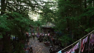 [MAN SPEAKING INDISTINCTLY] - The 100