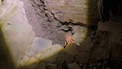 Marco descends
into the underground chamber. - Lost Treasures of Rome