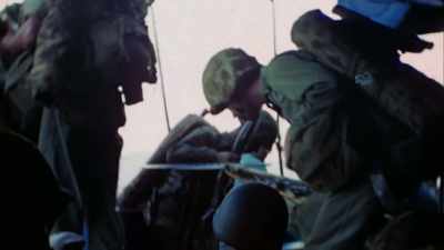MARINES CLIMB DOWN NETS
INTO LANDING CRAFT. - The Pacific War in Color