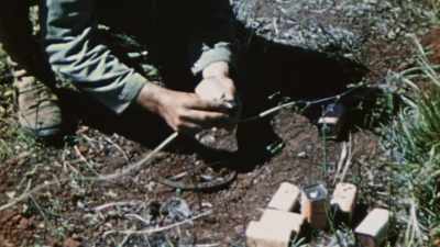 MARINES USE THEIR OWN EXPLOSIVES
TO DETONATE THEM SAFELY. - The Pacific War in Color