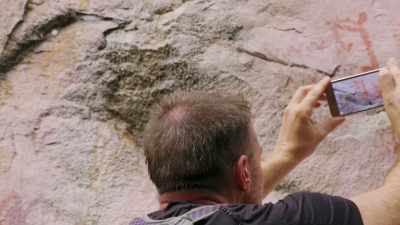 MARK SCOURS THE STRANGE DESIGNS
FOR CLUES. - Lost Cities of the Amazon
