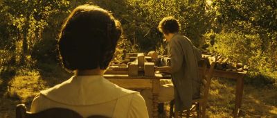 Mathilde leans back against her chair - A Very Long Engagement
