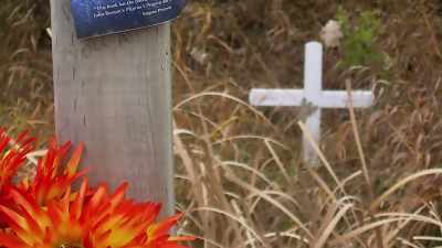 May had the little roadside memorial and
there was a post next to it and on the posts - Restoring the Shack