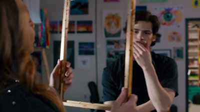Maybe she's holding the frame up
in a way - Imperfect High