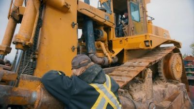 Mike jacks up the D10
using the dozer's blade. - Gold Rush