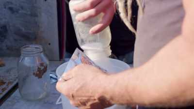...Mike and Shafin prepare the Tannerite
for target practice. - Rust Valley Restorers
